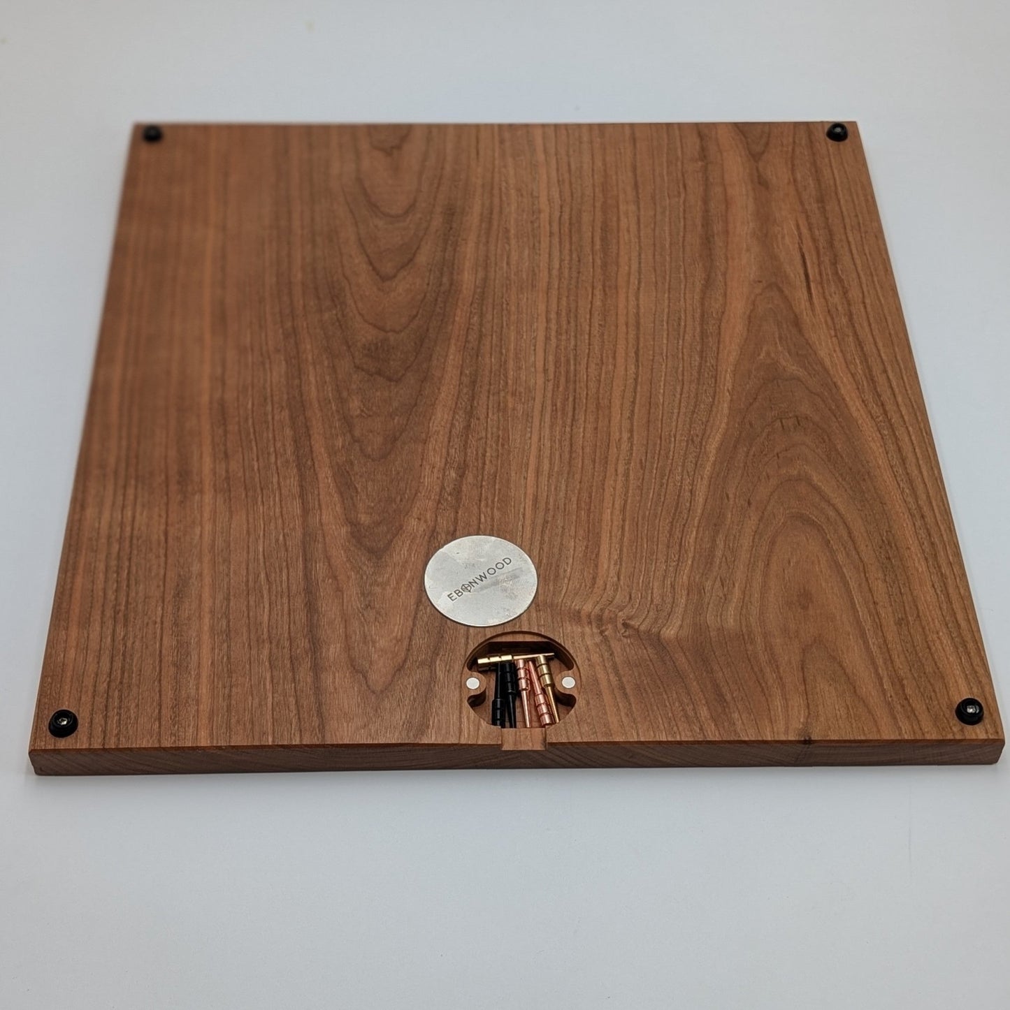 bottom of cribbage wars board showing off integrated peg storage using magnets and a steel plate with rubber feet in all 4 corners