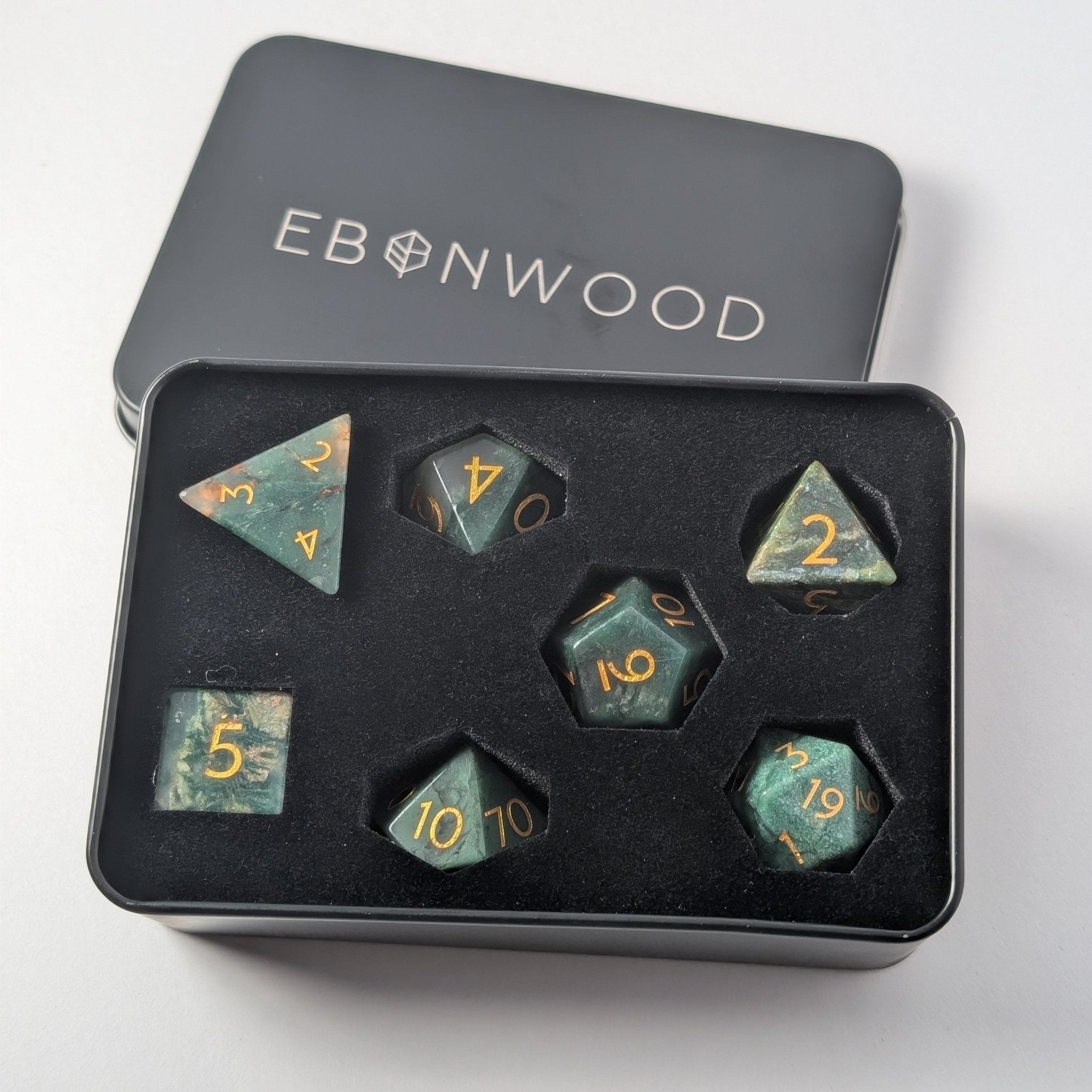 african jade gemstone dice set in metal dice tin with ebonwood logo engraved on the top of the tin