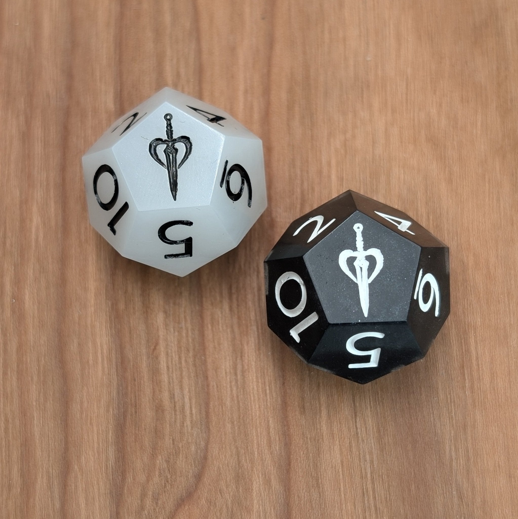 Two duality dice on a wooden surface