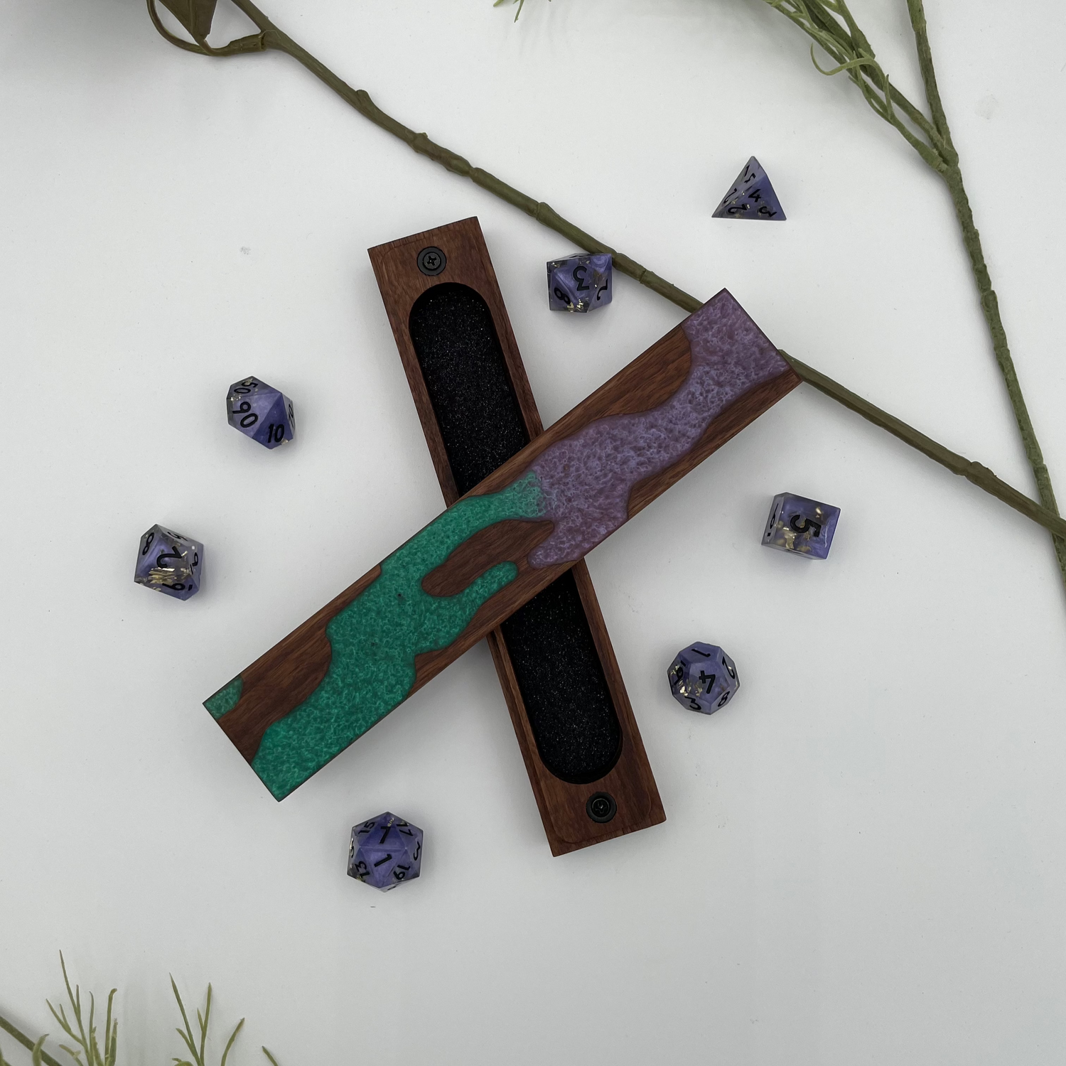 Picture of a dice vault with a natural live edge style resin inlay made of walnut wood.