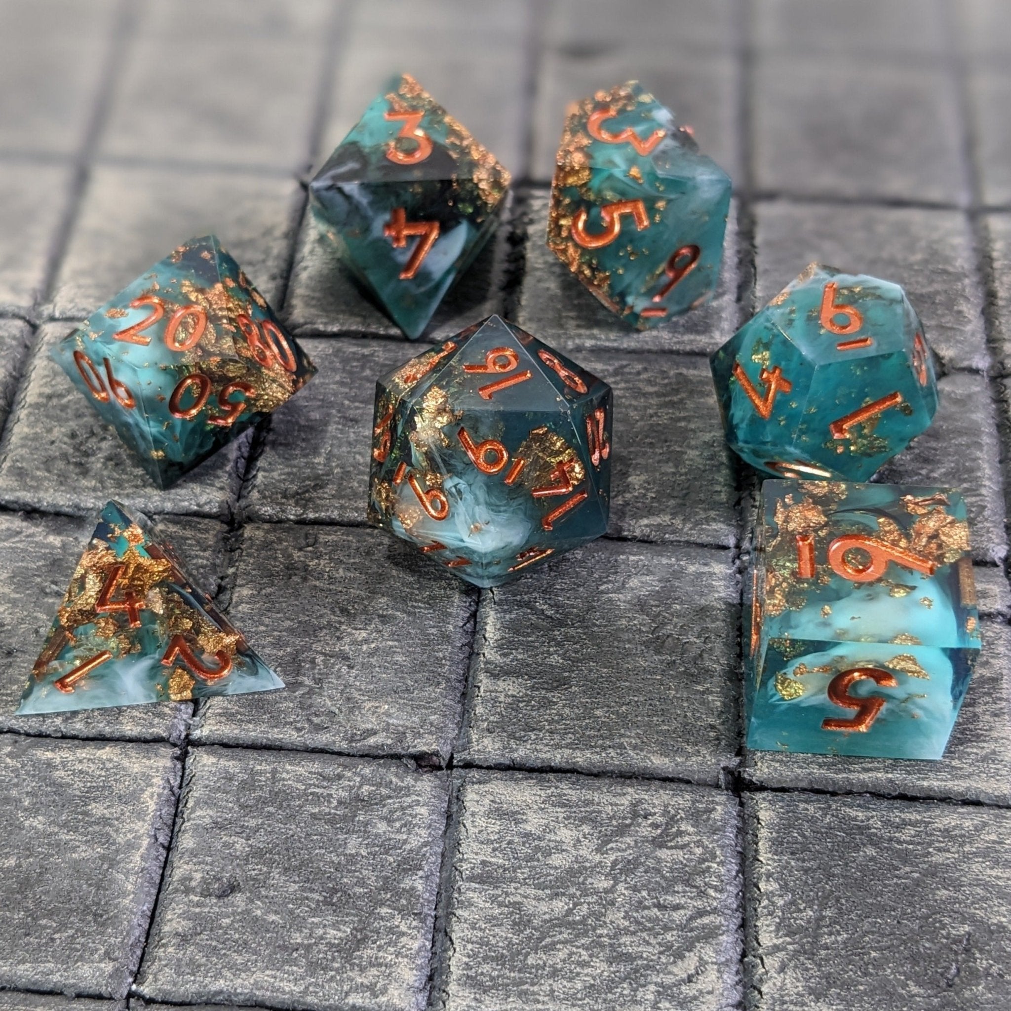 Polyhedral Dice set for Dungeons & Dragons on a grey tabletop gaming base.