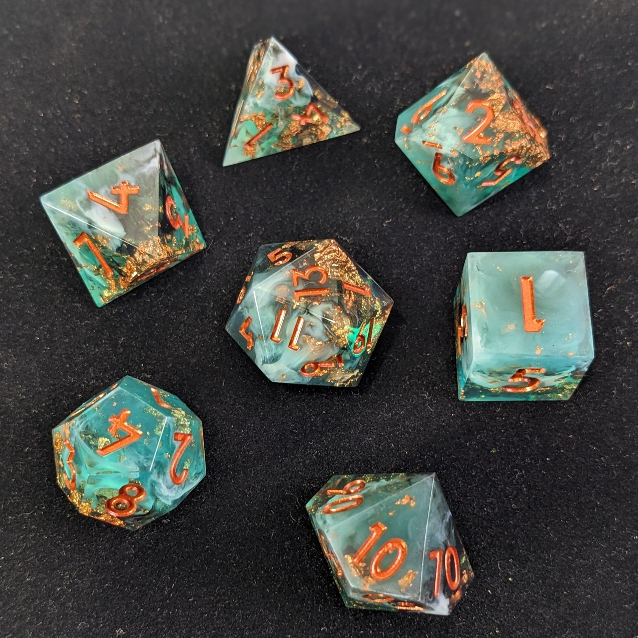 Sharp Edge Resin Dice Shot Above with all 7 dice in shot