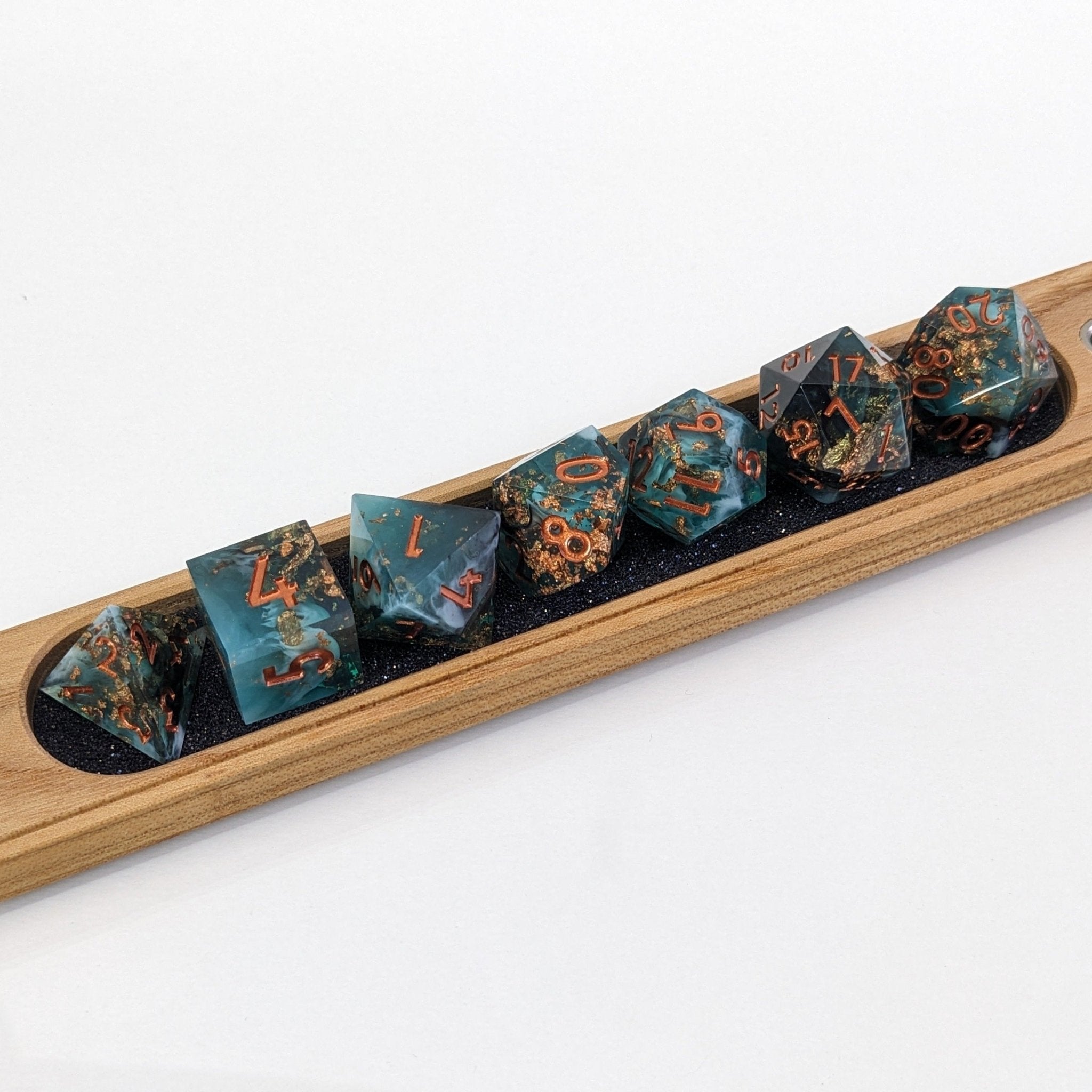 Sharp Edge Resin Dice in a dnd dice vault featuring cherry wood