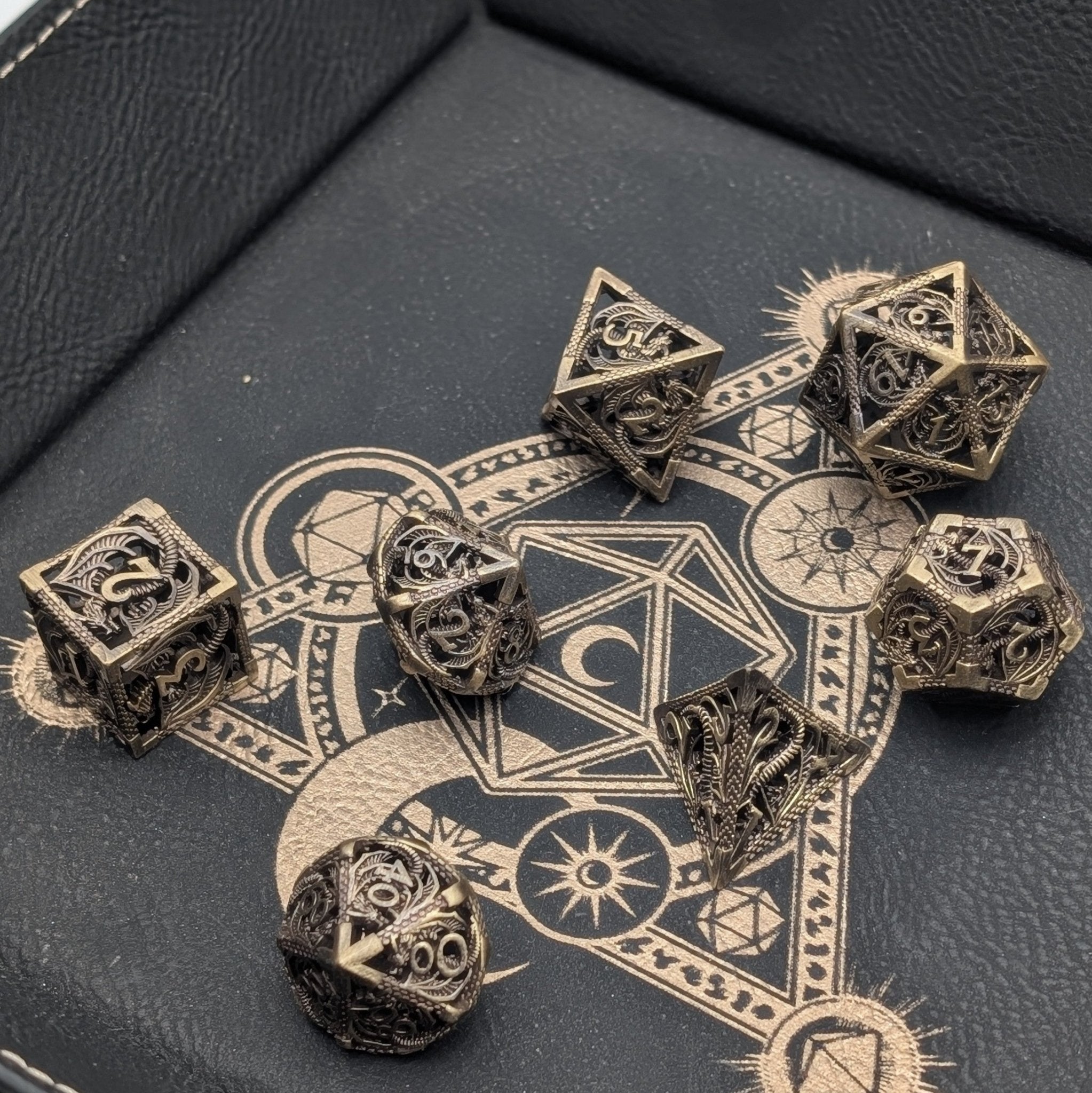 Chiming dragon dice set with tarnished brass finish for tabletop games