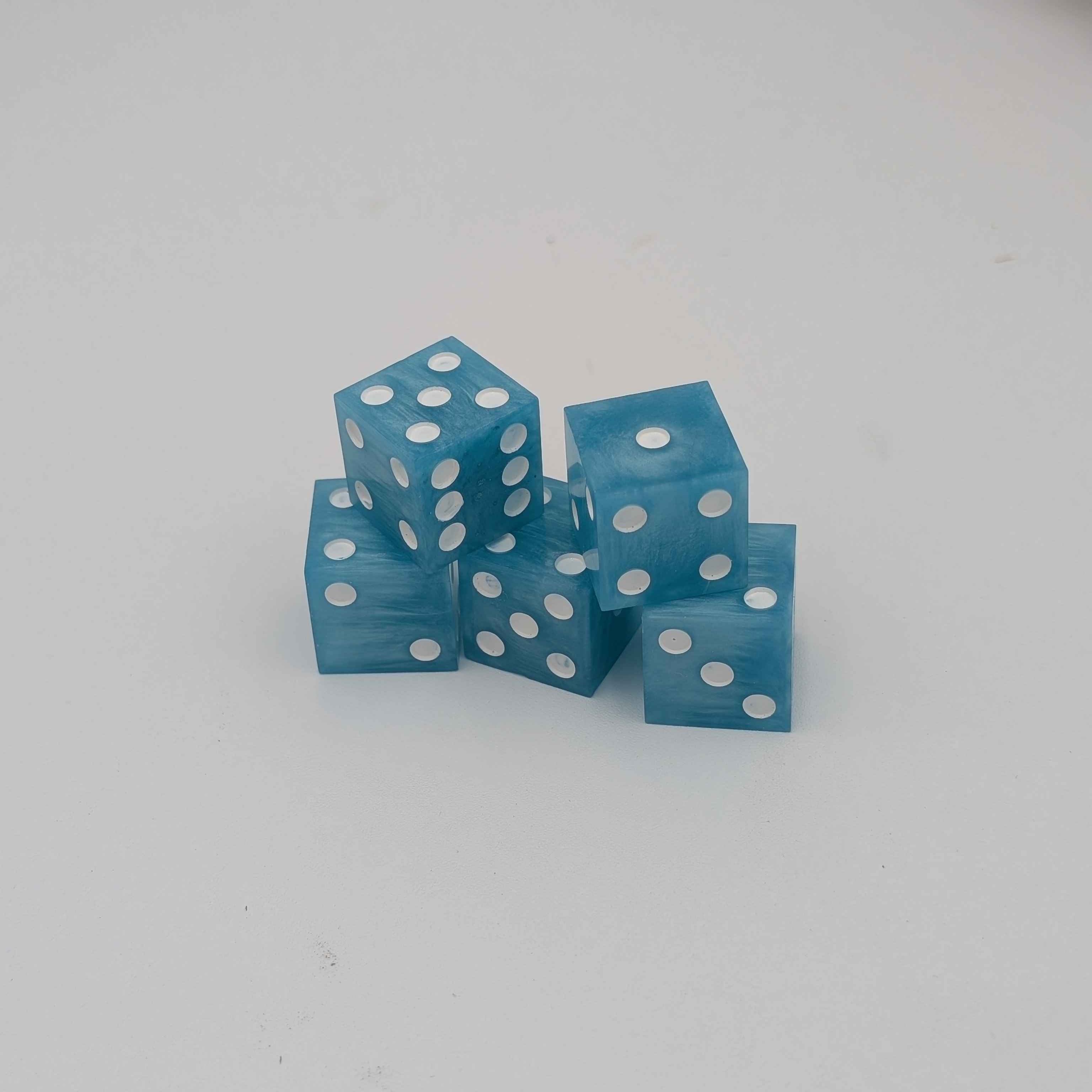 5 Glacier Blue Casino Dice with White Pips on a white background