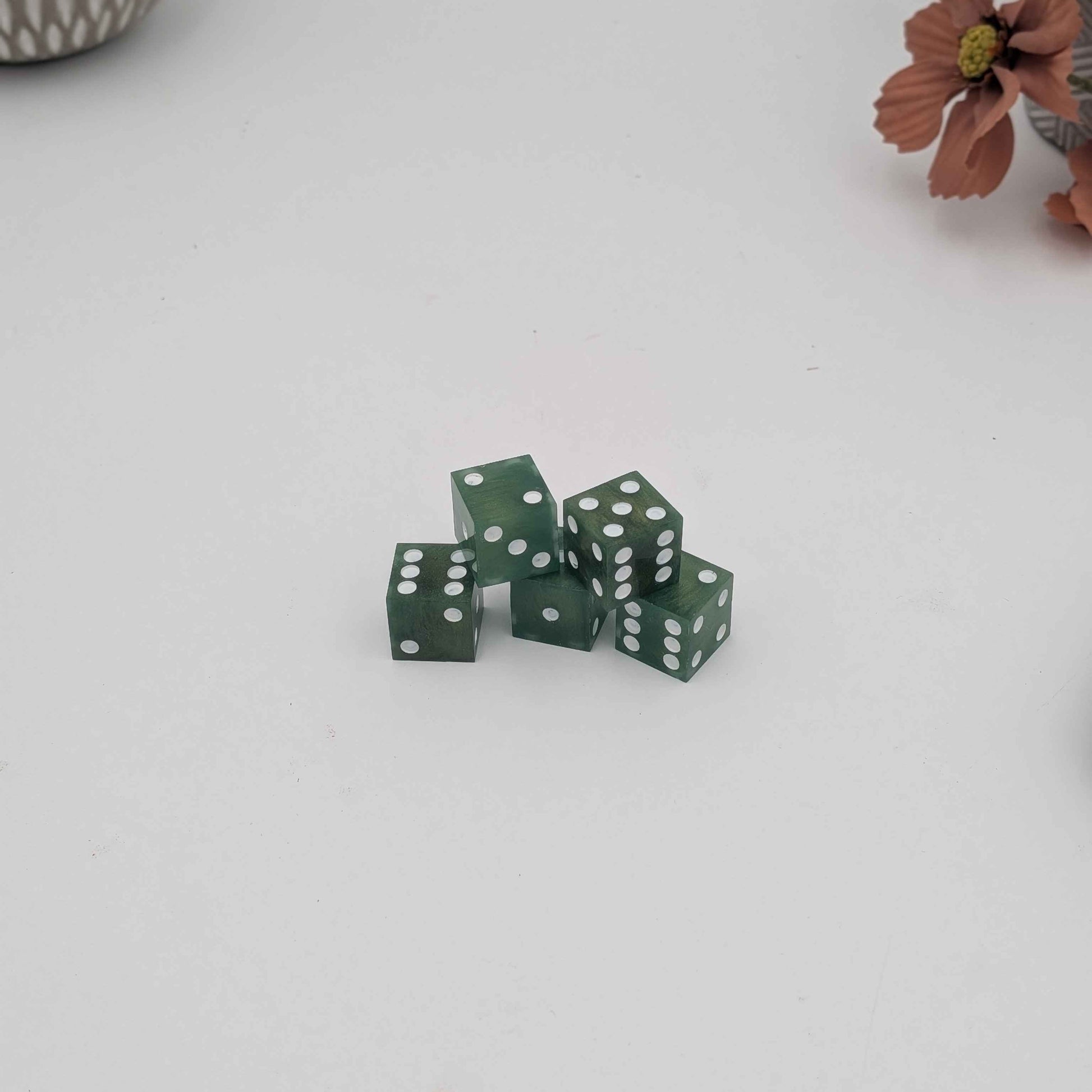 Handmade Green Sharp Edge Dice Set with White Pips on White Background for war games like warhammer 40k