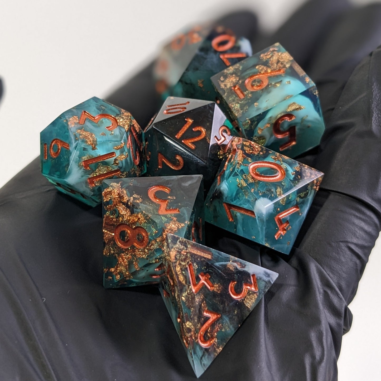 Sharp Edge Resin Dice Set for Dungeons & Dragons held in hand