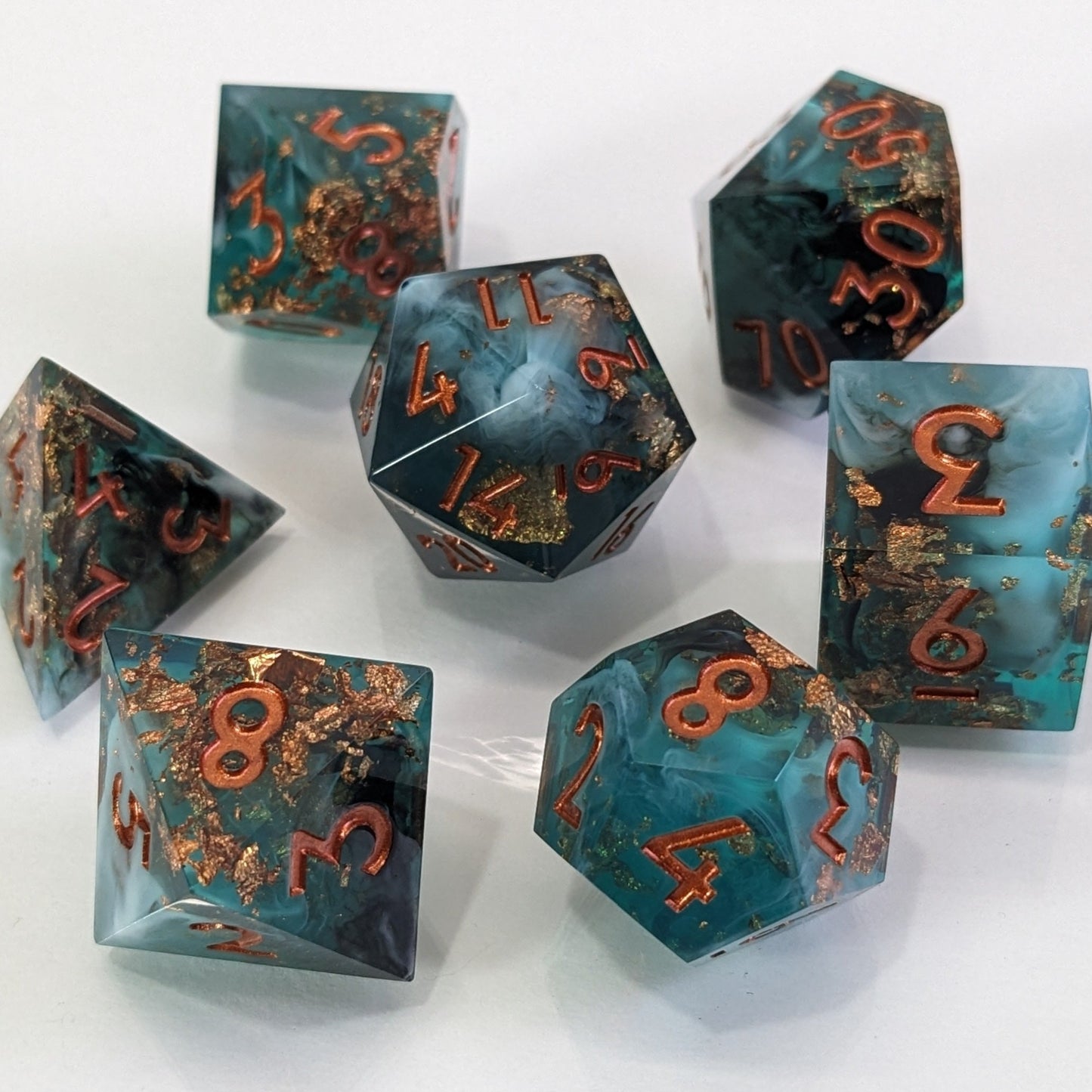 Sharp Edge Resin Dice Set with Copper Paint on White Background