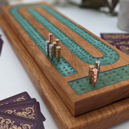 luxury cribbage board made of cherry wood and resin inlay made in america in wisconsin with metal pegs