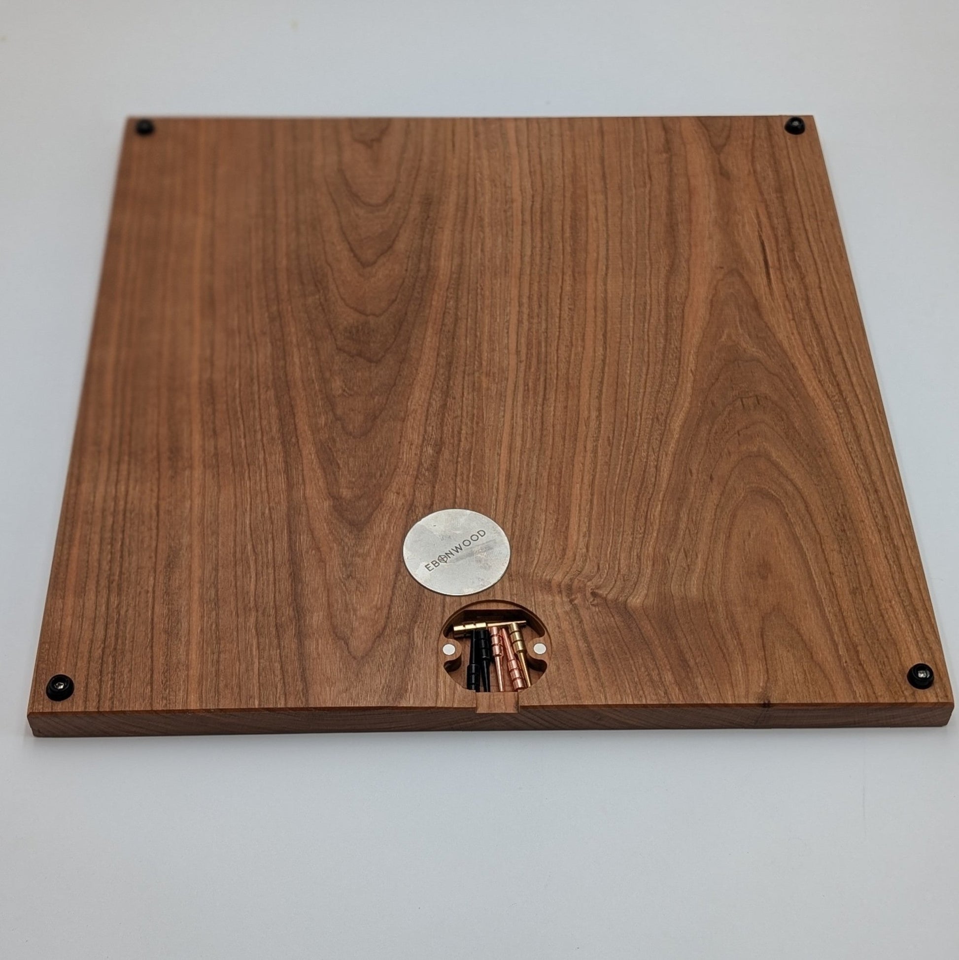 bottom of cribbage wars board showing off integrated peg storage using magnets and a steel plate with rubber feet in all 4 corners