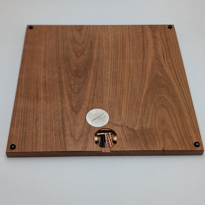 bottom of cribbage wars board showing off integrated peg storage using magnets and a steel plate with rubber feet in all 4 corners