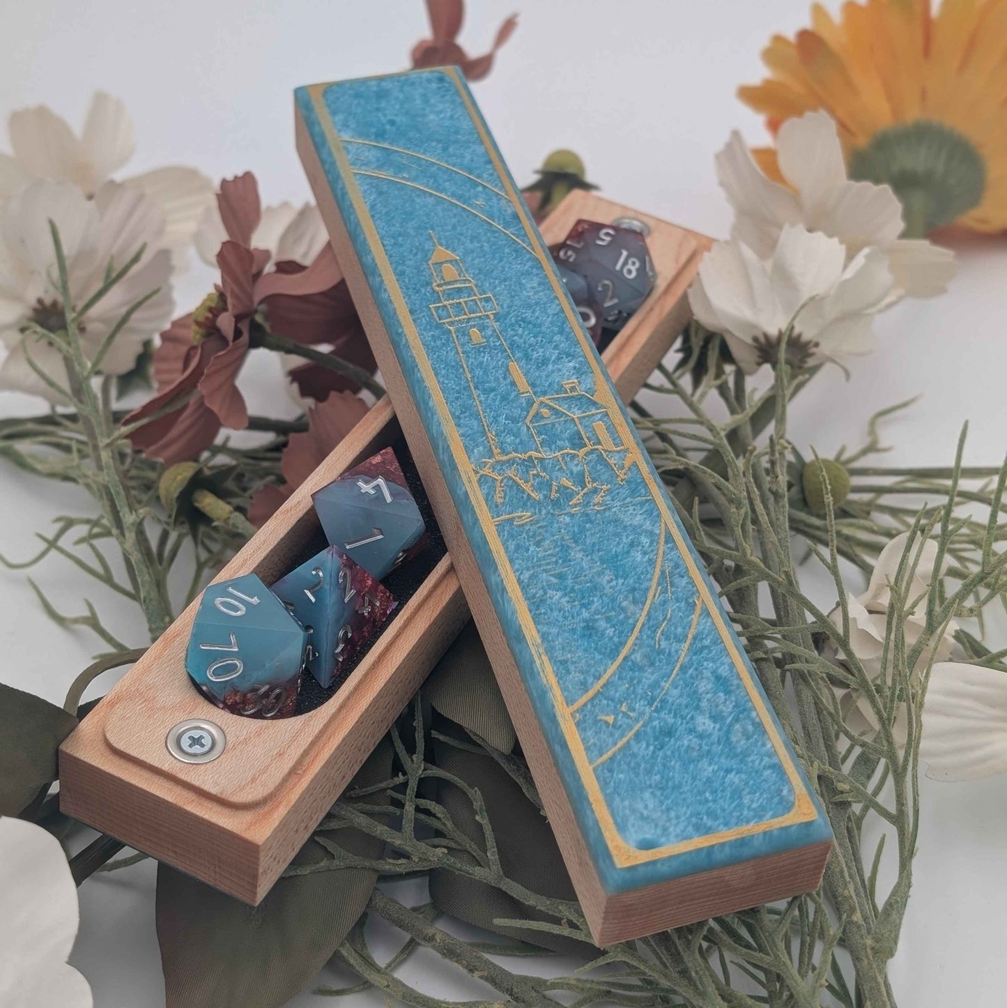 Wooden dice vault featuring a gold-engraved lighthouse design with customizable resin and paint fill options