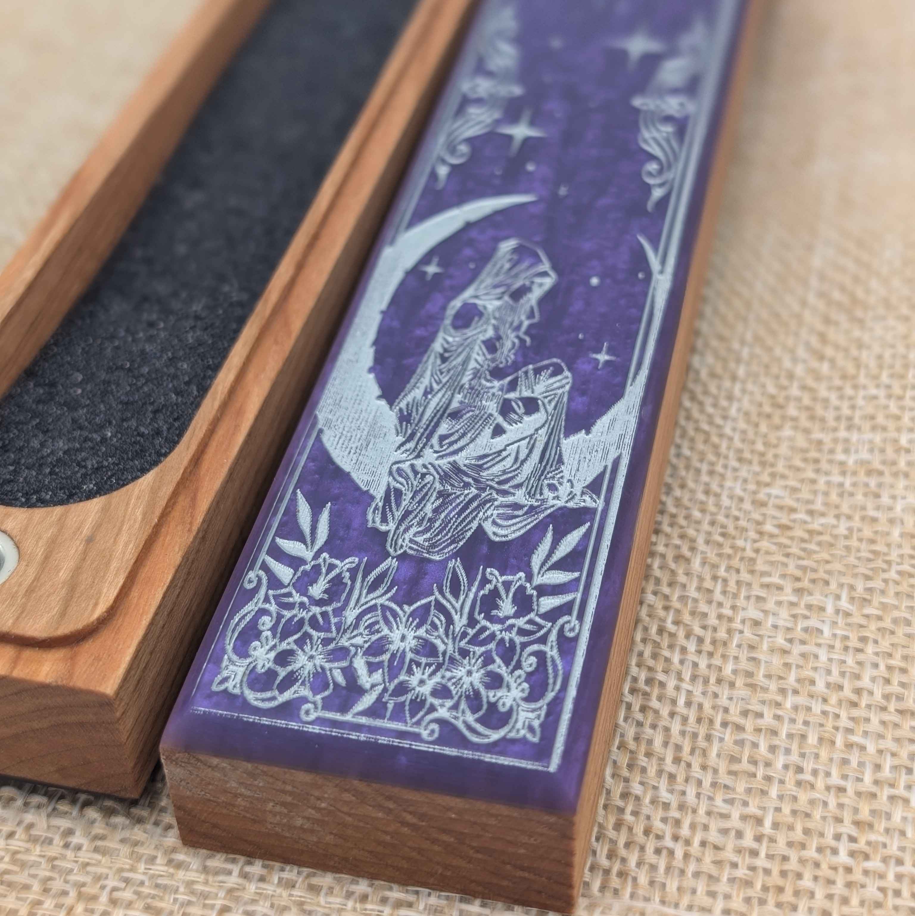Open view of the Lunar Whispers dice case, showing soft foam lining for protecting polyhedral dice.