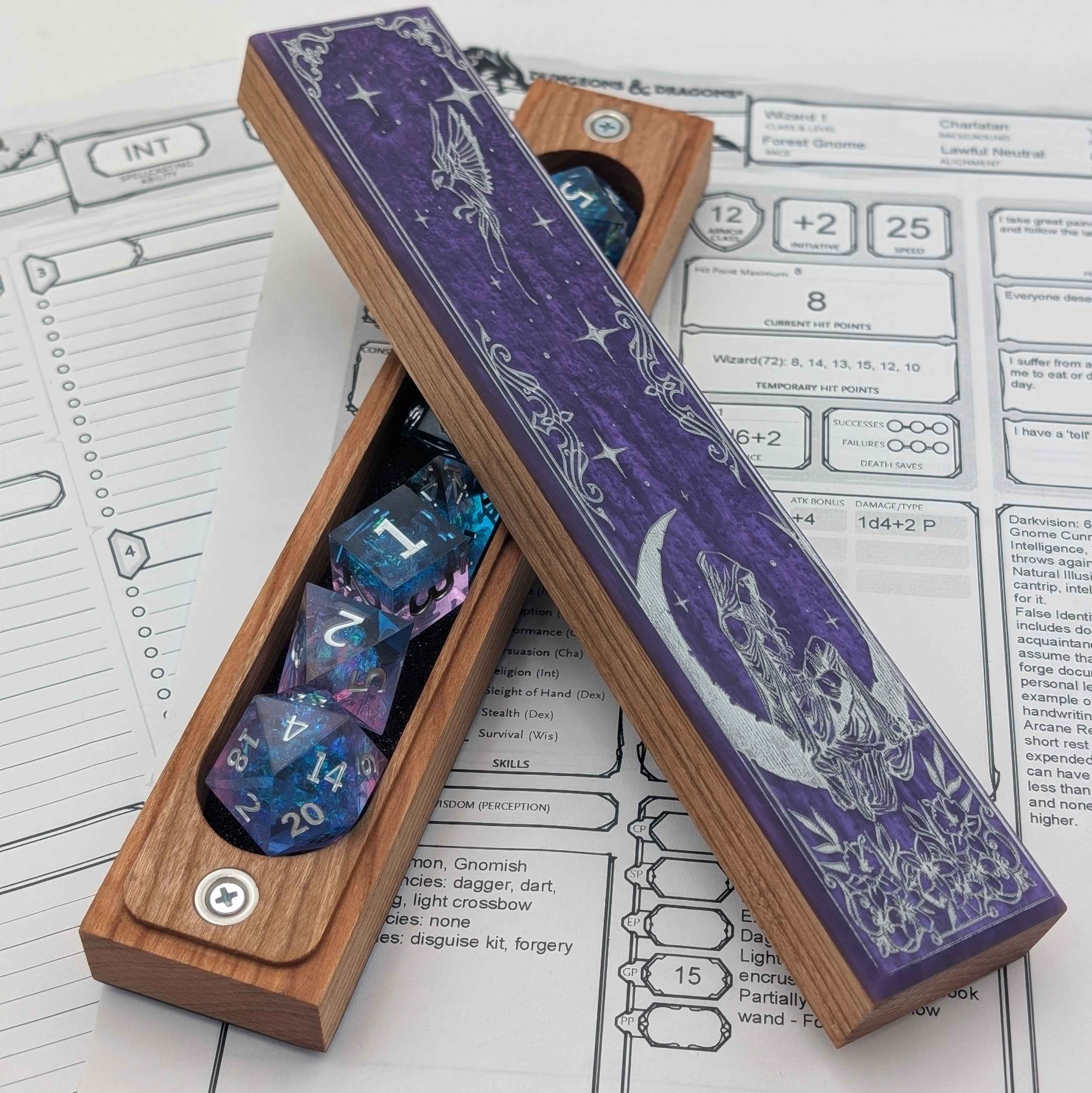 Tabletop RPG dice storage case featuring a moonlit engraving of a robed figure and fairies