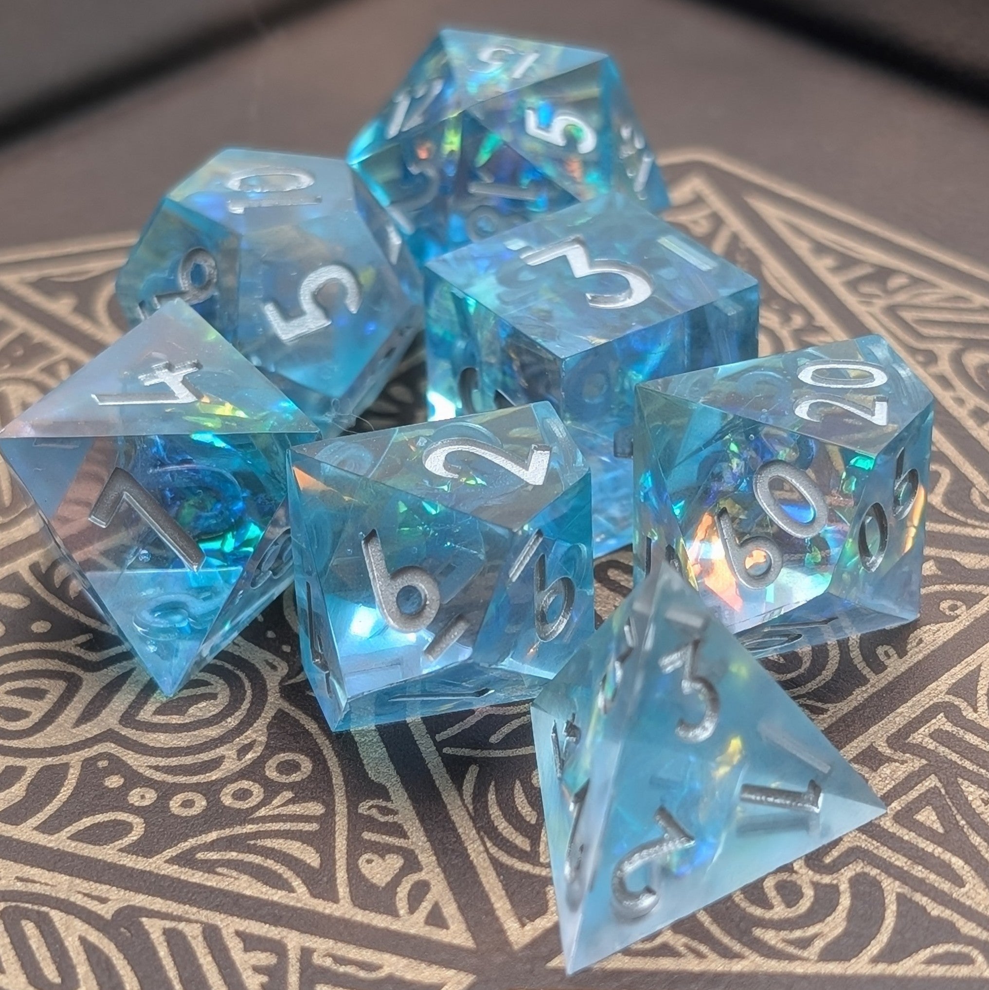 Luxury polyhedral dice set with ocean-inspired design and iridescent foil flakes