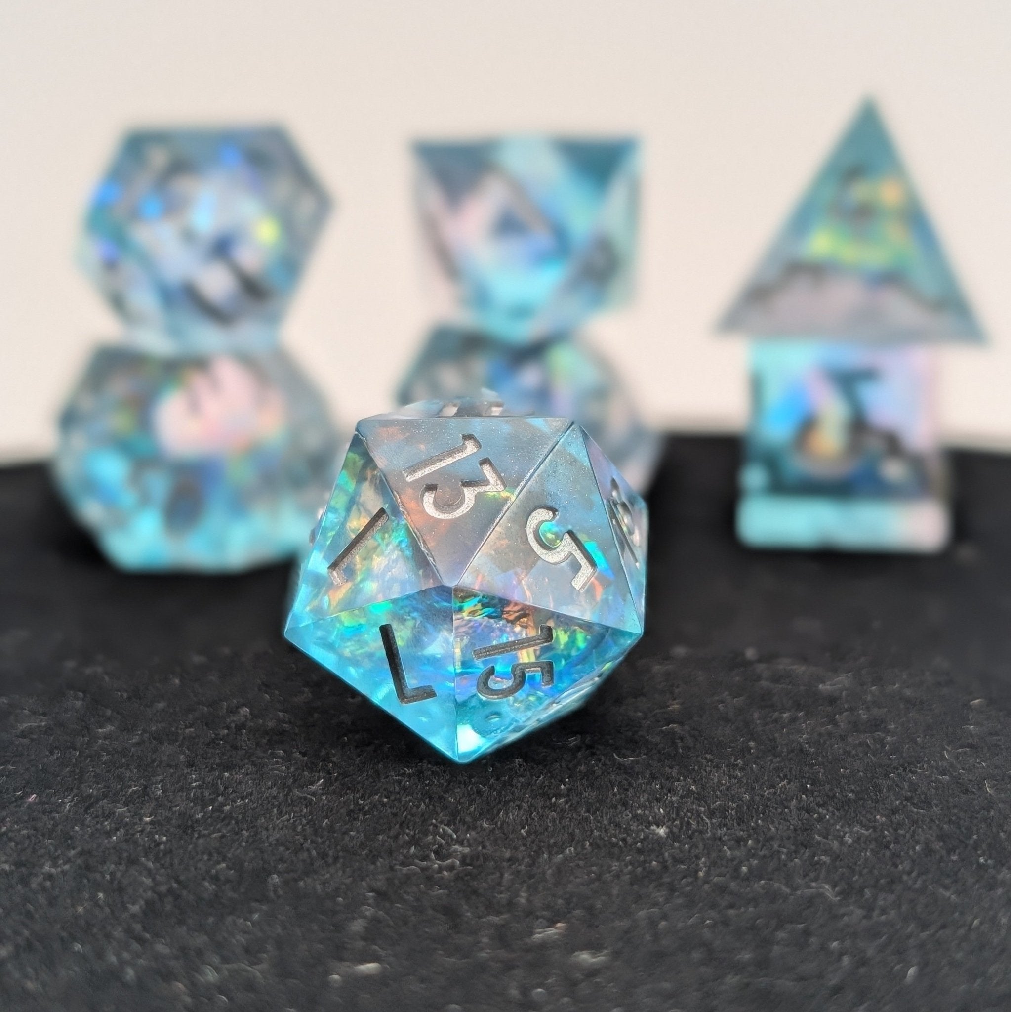 Detailed macro image of Oceanheart Opals D20 die with shimmering oceanic colors