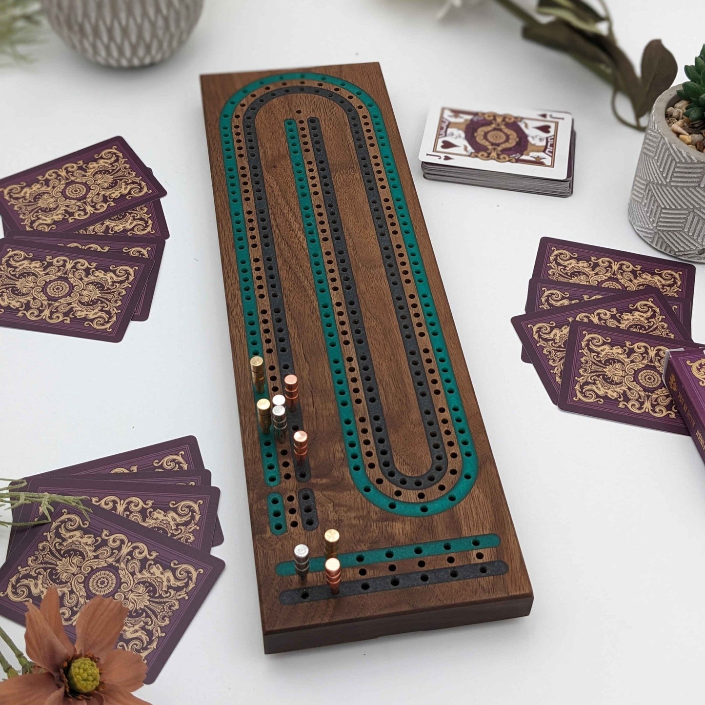 luxury walnut cribbage board with emerald green and onyx grey resin inlay