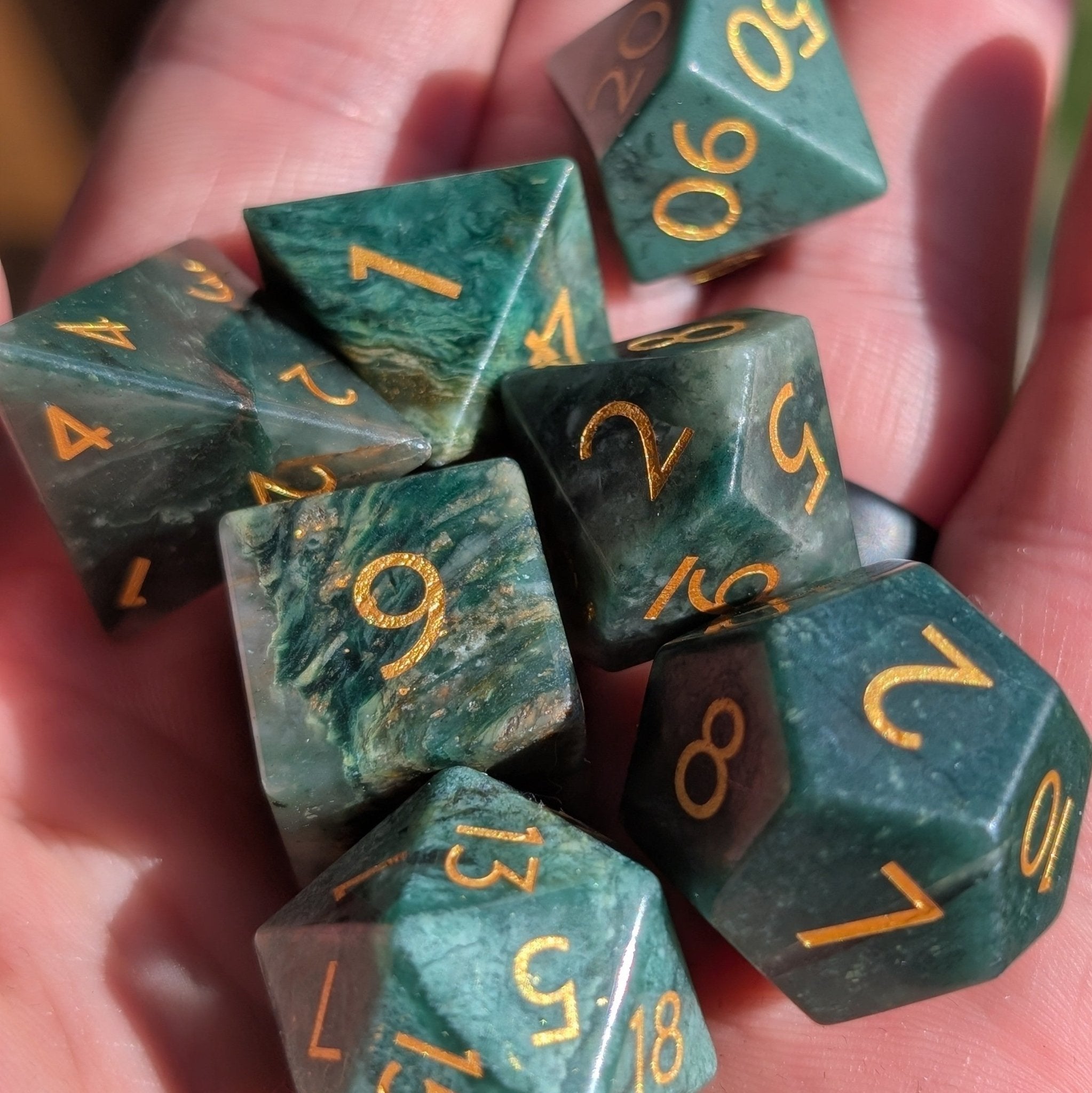 African Jade gemstone dice set held in hand