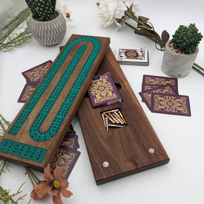 handmade walnut cribbage board with emerald epoxy resin inlay with card and page storage side view showing board card storage