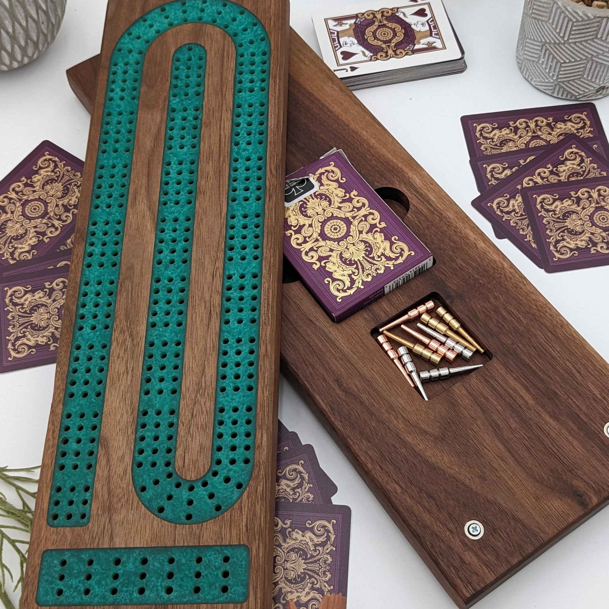 handmade walnut cribbage board with emerald epoxy resin inlay with card and page storage