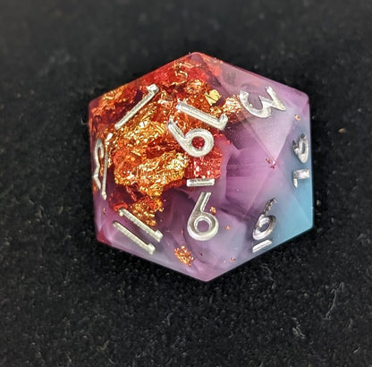 Blue, Purple, and pink d20 with silver numbers and golf foil inclusions on black background